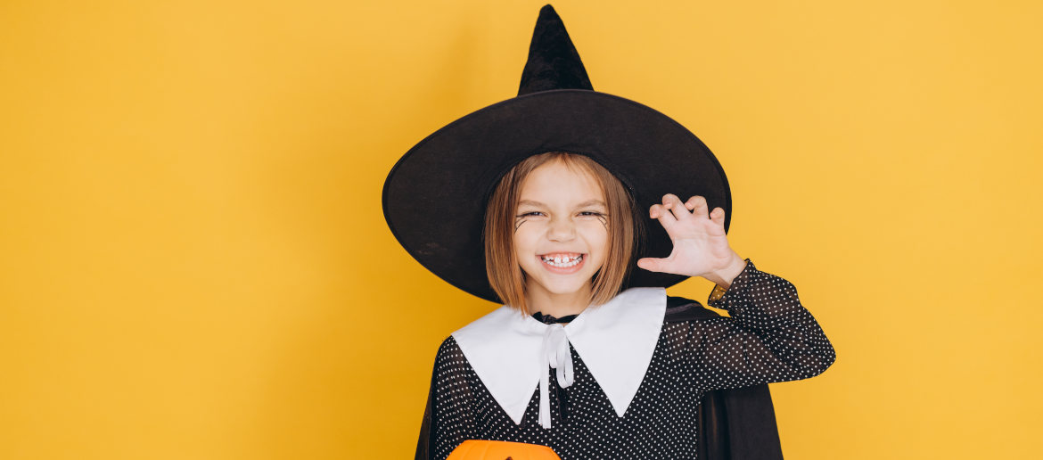 Young girl dressed as halloween witch